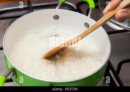 Rice Pudding with cinamon and raisins preparation : Rice preparation Stock Photo