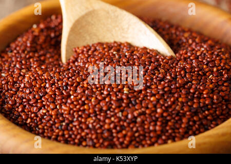 Dry red quinoa in a bowl close-up. horizontal background Stock Photo
