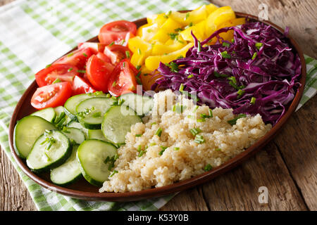 Colorful salad with fresh vegetables and quinoa close up on a plate. horizontal Stock Photo