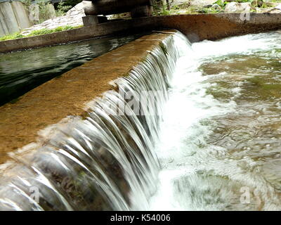 small waterfall, artificial cascade on the river, Stock Photo