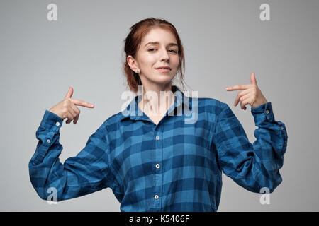 Portrait of caucasian woman with red hair. She is proud of herself Stock Photo