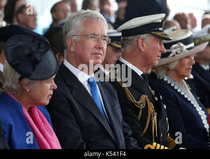 (Left-right) Lady Wendy Fallon, Defence Secretary Sir Michael Fallon, the Prince of Wales and the Duchess of Cornwall, known as the Duke and Duchess of Rothesay while in Scotland, during a naming ceremony of aircraft carrier HMS Prince of Wales at the Royal Dockyard in Rosyth. Stock Photo