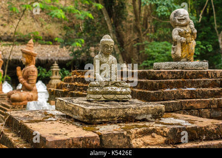 CHIANG MAI, THAILAND - 5/14/2015: Buddhist statues and figurines at Wat Pha Lat. Stock Photo