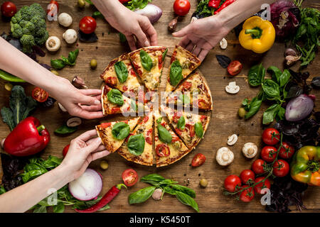 friends eating pizza Stock Photo