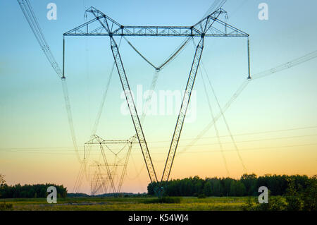 high voltage post. High-voltage tower sky background. Stock Photo
