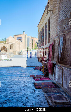 BUKHARA, UZBEKISTAN - SEPTEMBER 4: Traditonal uzbek carpets for sale on the street in downtown of Bukhara. September 2016 Stock Photo