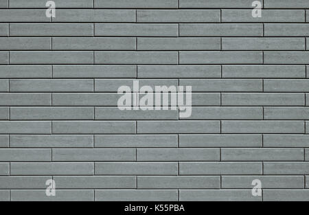 Template background with a wall texture made from gray decorative bricks. Stock Photo