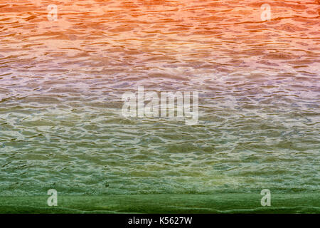 Multicolored wavy water surface as background image. Stock Photo