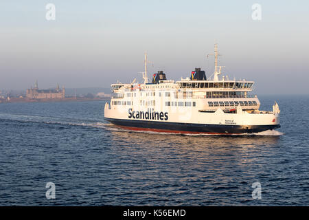 Scandlines ferry Aurora leaving the harbour in Helsingör, Denmark. The casrle Kronborg is seen in the background. Stock Photo