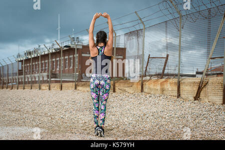 woman stretching arms before exercise Stock Photo
