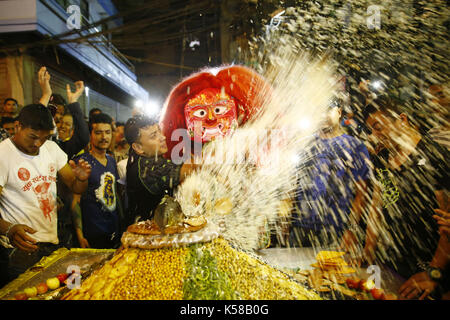 Kathmandu, Nepal. 8th Sep, 2017. A Lakhey receives ''Samyabaji'' offerings placed by devotees during Indra Jatra festival in Kathmandu, Nepal on Friday, September 08, 2017. Credit: Skanda Gautam/ZUMA Wire/Alamy Live News Stock Photo