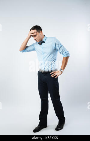 Cheerless sad man feeling depressed Stock Photo