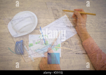 Double exposure of woman working on architectural projects Stock Photo