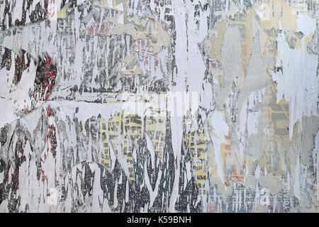 Layers of torn paper peeled posters abstract grunge background texture. Stock Photo