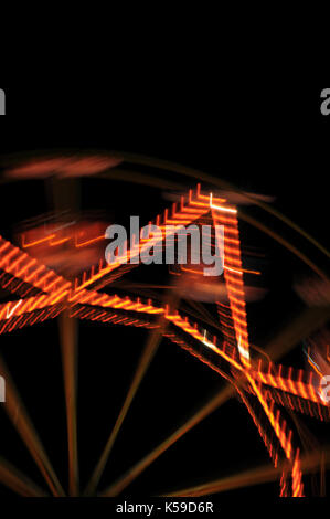Abstract motion blur of rotating ferris wheel at night on Brisbane ...