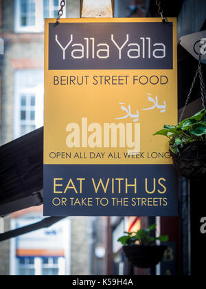 Yalla Yalla Lebanese Beirut Street Food restaurant in Green Court in Londons' Soho entertainment district Stock Photo