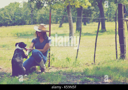 Woman in Western Wear in Cowboy Hat, Jeans and Cowboy Boots. Stock Image -  Image of barn, agricultureindustry: 112660183