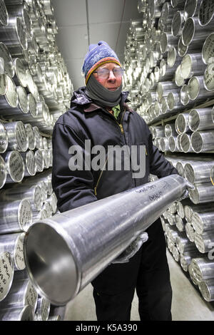 Denver, Colorado - Geoff Hargreaves, curator at the National Ice Core Laboratory, holds a one-meter section of an ice core stored at -36 degrees C (-3 Stock Photo