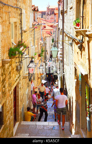 Dubrovnik, Croatia - Jine 12, 2017: People in old narrow street with stairs in Dubrovnik, Croatia Stock Photo