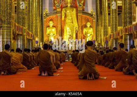CHIANG MAI, THAILAND - 1/18/2016: Monks praying at Wat Chedi Luang temple in Chiang Mai, Thailand. Stock Photo