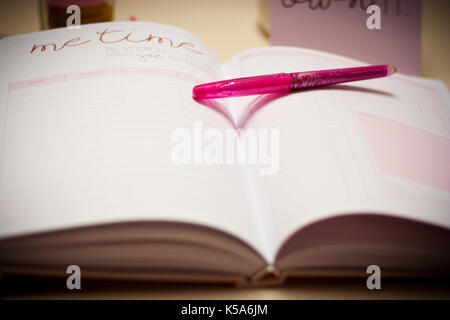 takig notes and work with passion with magic planner. Easy planning at your work space. Stock Photo