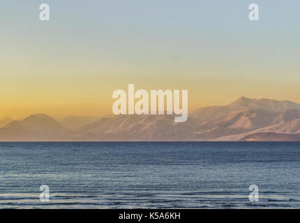 looking out across the ocean to the Albanian mountains in the distance Stock Photo