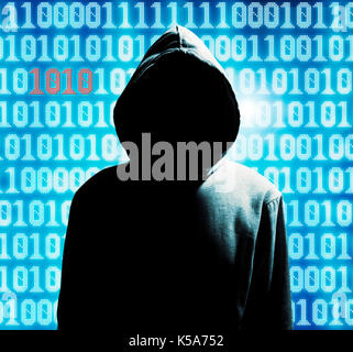 mysterious hacker in hood Stock Photo