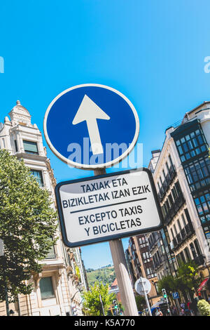 BILBAO, SPAIN - July 19, 2016 : in a street Ahead only sign with a sign where it is written in Catalan and Spanish - except taxis and bicycles Stock Photo