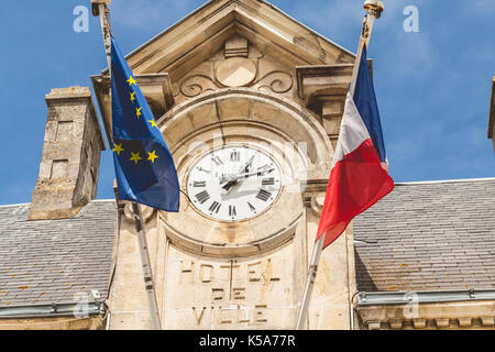 NOIRMOUTIER, FRANCE - July 03, 2017 : architecture detail of the town hall of Noirmoutier, France with its clock Stock Photo