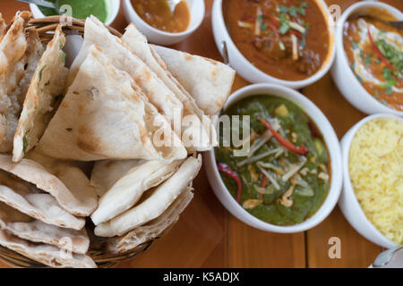Indian cuisine, Roti and rice with red and green curry Stock Photo