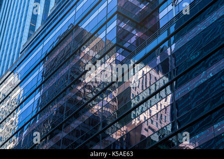 Close up of the reflections on the glass windows of the high rises in New York City, New York Stock Photo