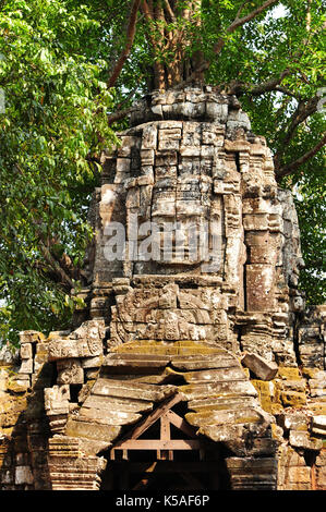 Buddha Face Carved On Stone At Angkor Wat Temple,Cambodia Stock Photo