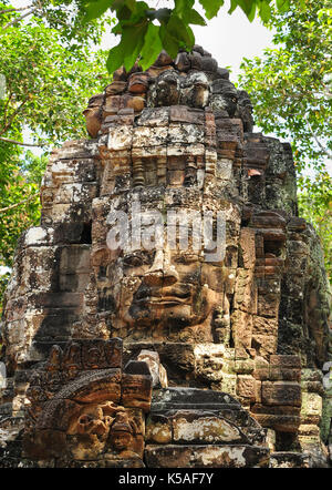 Buddha Face Carved On Stone At Angkor Wat Temple,Cambodia Stock Photo