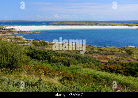 Distant view of white sands at Dog's Bay near Roundstone in Connemara, County Galway, Republic of Ireland Stock Photo