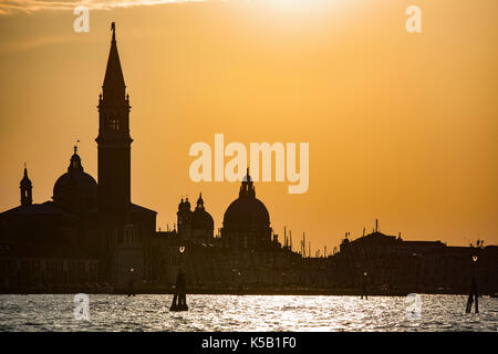 Venice, Wenedig, Wenecja - an old medieval city on water, between canals. View from a sail boat or from the bridges. Stock Photo