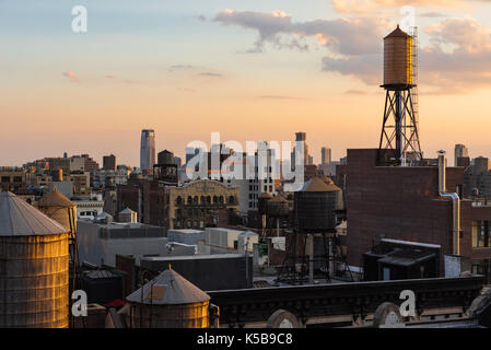 Summer sunset with Chelsea rooftops, and water towers. Manhattan, New York City Stock Photo