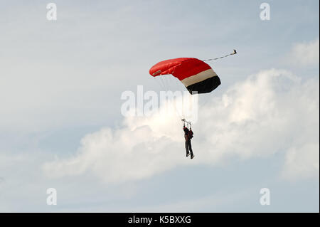 Skydiver On Parachute In Sunny Clear Sky At Sunset Or Sunrise Time Active Hobbies Parachutist Paratrooper In Colorful Dawn Sky Stock Photo Alamy