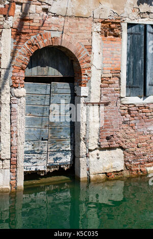 Venice, Wenedig, Wenecja - an old medieval city on water, between canals. View from a sail boat or from the bridges. Stock Photo