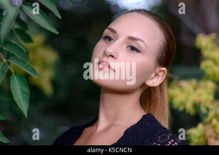 beautiful young girl in the summer Park Stock Photo