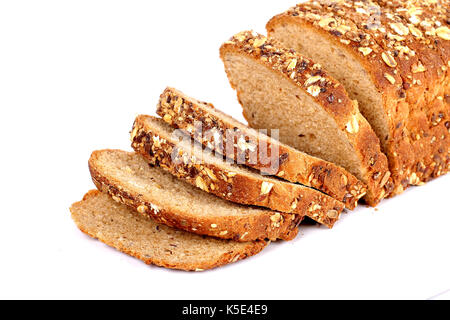 multi grain bread with slices on white surface Stock Photo