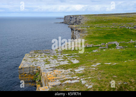 Dramatic sheer cliffs at Dun Aonghasa, a prehistoric stone fort, on Inishmore Island in the Aran Group, County Galway, Republic of Ireland Stock Photo