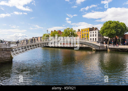 The Ha'penny Bridge, known later for a time as the Penny Ha'penny Bridge, and officially the Liffey Bridge, is a pedestrian bridge built in May 1816 o Stock Photo