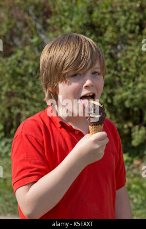 young boy eating ice cream Stock Photo