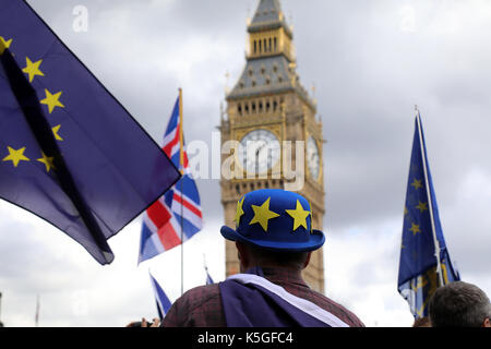 London, UK. 9th Sept, 2017. A man wearing a bowler hat with the stars of the EU flag stands in Parliament Square Garden in Westminster, central London, during the People's March for Europe, an anti-Brexit rally, on 9 September 2017. The clock tower of Big Ben is in the background. Credit: Dominic Dudley/Alamy Live News Stock Photo