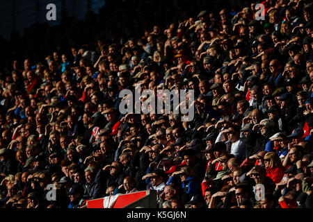 Stoke-on-Trent, UK. 09th Sep, 2017. Stoke City fans shield their eyes frm the setting sun during the Premier League match between Stoke City and Manchester United at Bet365 Stadium on September 9th 2017 in Stoke-on-Trent, England. Credit: PHC Images/Alamy Live News Stock Photo