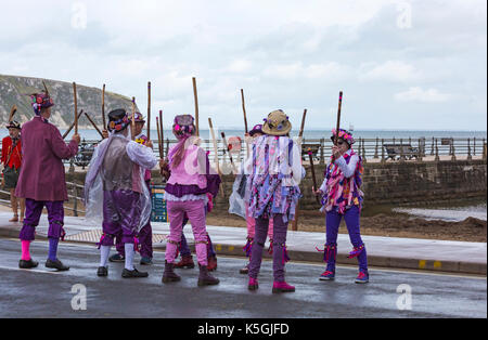 Swanage, Dorset, UK. 9th Sep, 2017. Crowds flock to the Swanage Folk Festival on the 25th anniversary to see the dance groups and music along the seafront. The mixed weather, sunshine and rain, doesn't deter their spirits. Morris dancers members of Guith Morris side perform. Credit: Carolyn Jenkins/Alamy Live News Stock Photo