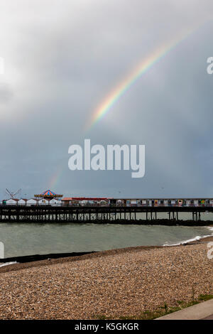 Herne Bay, Kent, 9th September. UK Weather News. Fooling a changeable day on the coast at Herne Bay, with showers, cloud and sunshine against a stormy sky a Rainbow appears over the Town and Pier. Credit: Richard Donovan/Alamy Live News Stock Photo