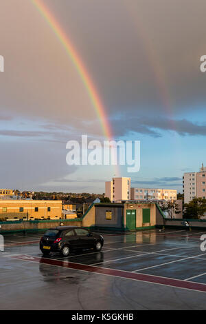 Herne Bay, Kent, 9th September. UK Weather News. Fooling a changeable day on the coast at Herne Bay, with showers, cloud and sunshine against a stormy sky a Rainbow appears over the Town and Pier. Credit: Richard Donovan/Alamy Live News Stock Photo