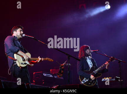 Hoppegarten, Germany. 9th Sep, 2017. The British Folk-Rock band Mumford & Sons with singer and guitarist Marcus Mumford (l) and guitarist 'Country' Winston Marshall performs at the Lollapalooza festival in Hoppegarten, Germany, 9 September 2017. The music festival is held over two days on the 9 and 10 September. Photo: Jens Kalaene/dpa-Zentralbild/dpa/Alamy Live News Stock Photo