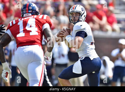 Oxford, MS, USA. 9th Sep, 2017. Tennessee-Martin quarterback Troy Cook (right) is pressured by a Mississippi defender during the fourth quarter of a NCAA college football game at Vaught-Hemmingway Stadium in Oxford, MS. Mississippi won 45-23. Austin McAfee/CSM/Alamy Live News Stock Photo